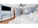 Bedroom showcasing a blue color scheme, hardwood floors, a king bed, and stylish furniture at 1235 Lake Point Dr, Lakeland, FL 33813