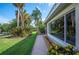 Property with lush front yard, landscaping, and a view through the large front window at 1235 Lake Point Dr, Lakeland, FL 33813