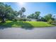 Beautifully landscaped front yard with an American flag at 1235 Lake Point Dr, Lakeland, FL 33813