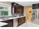 Well-appointed kitchen with modern appliances, sleek cabinetry, and a mosaic backsplash at 1235 Lake Point Dr, Lakeland, FL 33813