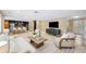 Open-concept living area featuring neutral tones, with access to kitchen area at 1235 Lake Point Dr, Lakeland, FL 33813