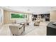 Bright living area with open floor plan to kitchen, featuring modern decor and natural light at 1235 Lake Point Dr, Lakeland, FL 33813