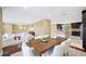 Inviting open concept living and dining space with a view of the modern kitchen and island at 1235 Lake Point Dr, Lakeland, FL 33813