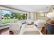 Bright living room with a large window and comfortable seating arrangements at 1235 Lake Point Dr, Lakeland, FL 33813