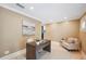 Cozy home office with neutral tones, comfortable seating, and a stylish desk, perfect for remote work at 1235 Lake Point Dr, Lakeland, FL 33813