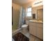 Standard bathroom featuring a shower with a curtain, a toilet, and a vanity with white cabinets at 1410 Bramblewood Dr, Lakeland, FL 33811