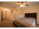 Spacious main bedroom with soft carpet, a ceiling fan, and convenient access to the hallway at 1410 Bramblewood Dr, Lakeland, FL 33811