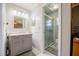 Bathroom with a glass shower, updated vanity, and tiled floor at 1434 Country Ridge Dr, Lakeland, FL 33801