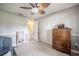 Neutral bedroom featuring a ceiling fan, closet, and adjacent door at 1434 Country Ridge Dr, Lakeland, FL 33801