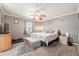 Bedroom with a neutral color scheme, plush carpet, dresser, and a nice window view at 1434 Country Ridge Dr, Lakeland, FL 33801