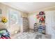 bedroom featuring plush carpet, dresser, and a built in shoe rack at 1434 Country Ridge Dr, Lakeland, FL 33801