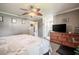 Bedroom featuring soft carpet, ceiling fan, and adjacent bathroom at 1434 Country Ridge Dr, Lakeland, FL 33801