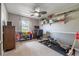 Bedroom featuring neutral walls, ceiling fan and exercise equipment at 1434 Country Ridge Dr, Lakeland, FL 33801