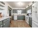 Functional kitchen with updated appliances, a new countertop, and wood-look floors at 1434 Country Ridge Dr, Lakeland, FL 33801