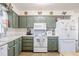 Charming kitchen featuring updated appliances, ample cabinetry, and a bright, welcoming atmosphere at 1434 Country Ridge Dr, Lakeland, FL 33801