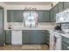 Traditional kitchen with neutral cabinets, white countertops, and modern appliances at 1434 Country Ridge Dr, Lakeland, FL 33801