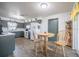 Eat in kitchen with a small table and chairs, neutral cabinets, and white appliances at 1434 Country Ridge Dr, Lakeland, FL 33801