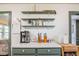 Kitchen counter with marble countertop, overhead shelving, and stainless steel appliances at 1434 Country Ridge Dr, Lakeland, FL 33801