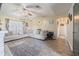 Spacious living room boasting wood-look floors, a sectional sofa, and a stylish decor at 1434 Country Ridge Dr, Lakeland, FL 33801