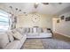Bright living room featuring a comfortable sectional sofa, stylish decor, and wood-look flooring at 1434 Country Ridge Dr, Lakeland, FL 33801