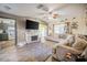 Open living room with wood-look floors and a view into the adjacent kitchen at 1434 Country Ridge Dr, Lakeland, FL 33801