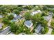 Wide aerial view of the neighborhood highlighting the location of the home and lake beyond at 1825 Pawnee Trl, Lakeland, FL 33803