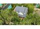 Aerial view of the home showcasing the roof, landscaping, and neighborhood at 1825 Pawnee Trl, Lakeland, FL 33803