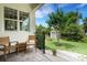 Charming back porch with stone pavers, view of storage shed, and lush landscaping at 1825 Pawnee Trl, Lakeland, FL 33803