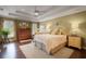 Spacious bedroom with ceiling fan, hardwood floors, and lots of natural light at 1825 Pawnee Trl, Lakeland, FL 33803