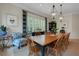Elegant dining room with stylish lighting and plantation shutters providing ample natural light at 1825 Pawnee Trl, Lakeland, FL 33803