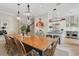 Open concept kitchen/dining showcasing natural light, staircase, and modern appliances at 1825 Pawnee Trl, Lakeland, FL 33803
