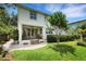 Exterior view of the two-story home with a covered porch and landscaped yard at 1825 Pawnee Trl, Lakeland, FL 33803