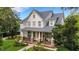 Charming two story home with welcoming front porch and beautiful landscaping at 1825 Pawnee Trl, Lakeland, FL 33803