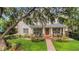 Beautiful two story home with welcoming front porch and manicured lawn at 1825 Pawnee Trl, Lakeland, FL 33803