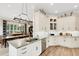 Kitchen features island with stainless appliances and adjacent dining area at 1825 Pawnee Trl, Lakeland, FL 33803