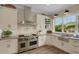 Updated kitchen with stainless steel appliances, tile backsplash, and lots of natural light at 1825 Pawnee Trl, Lakeland, FL 33803