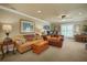 Comfortable living room featuring two sofas, a wooden chest, and lots of natural light at 1825 Pawnee Trl, Lakeland, FL 33803