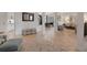 Open-concept living area with stylish furnishings, tile floors, and views of the dining room at 1825 Pawnee Trl, Lakeland, FL 33803