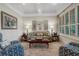 Comfortable living room with tray ceiling, shutters, stylish furnishings, and natural light at 1825 Pawnee Trl, Lakeland, FL 33803