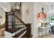 View of the beautiful wood staircase and adjacent living area at 1825 Pawnee Trl, Lakeland, FL 33803