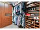 Organized walk-in closet with custom shelving, clothing racks, and built-in cabinets at 1825 Pawnee Trl, Lakeland, FL 33803