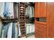 Well-organized walk-in closet with custom shelving, shoe storage, and hanging space at 1825 Pawnee Trl, Lakeland, FL 33803