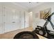 Spacious workout room featuring fitness equipment, neutral walls and tile flooring at 1825 Pawnee Trl, Lakeland, FL 33803