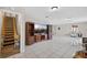 Basement featuring tile flooring, a staircase, and a media center at 1922 Matthew Ct, Lakeland, FL 33813