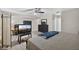 Cozy bedroom featuring carpeted floors, a black dresser, and a television at 1922 Matthew Ct, Lakeland, FL 33813