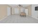 Dining area featuring tile floors, neutral walls, and bright ceiling fan at 1922 Matthew Ct, Lakeland, FL 33813