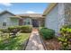 A close up of the home's main entrance and stone facade at 1922 Matthew Ct, Lakeland, FL 33813