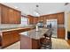 Well-lit kitchen with granite countertops, stainless steel appliances, and center island at 1922 Matthew Ct, Lakeland, FL 33813