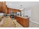 A spacious kitchen featuring granite counters, stainless steel appliances, and center island at 1922 Matthew Ct, Lakeland, FL 33813