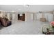 Bright and open living area with tile floors, neutral walls, and a dining area at 1922 Matthew Ct, Lakeland, FL 33813